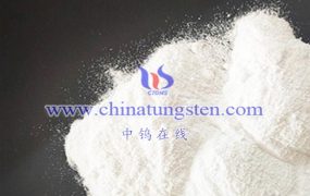 With which substances does Ammonium Metatungstate Hydrate react?