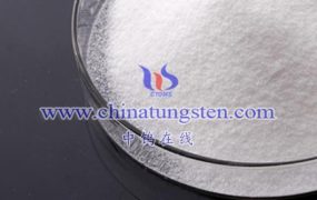 Ammonium Metatungstate Hydrate reacts with some chemicals that can be dangerous?